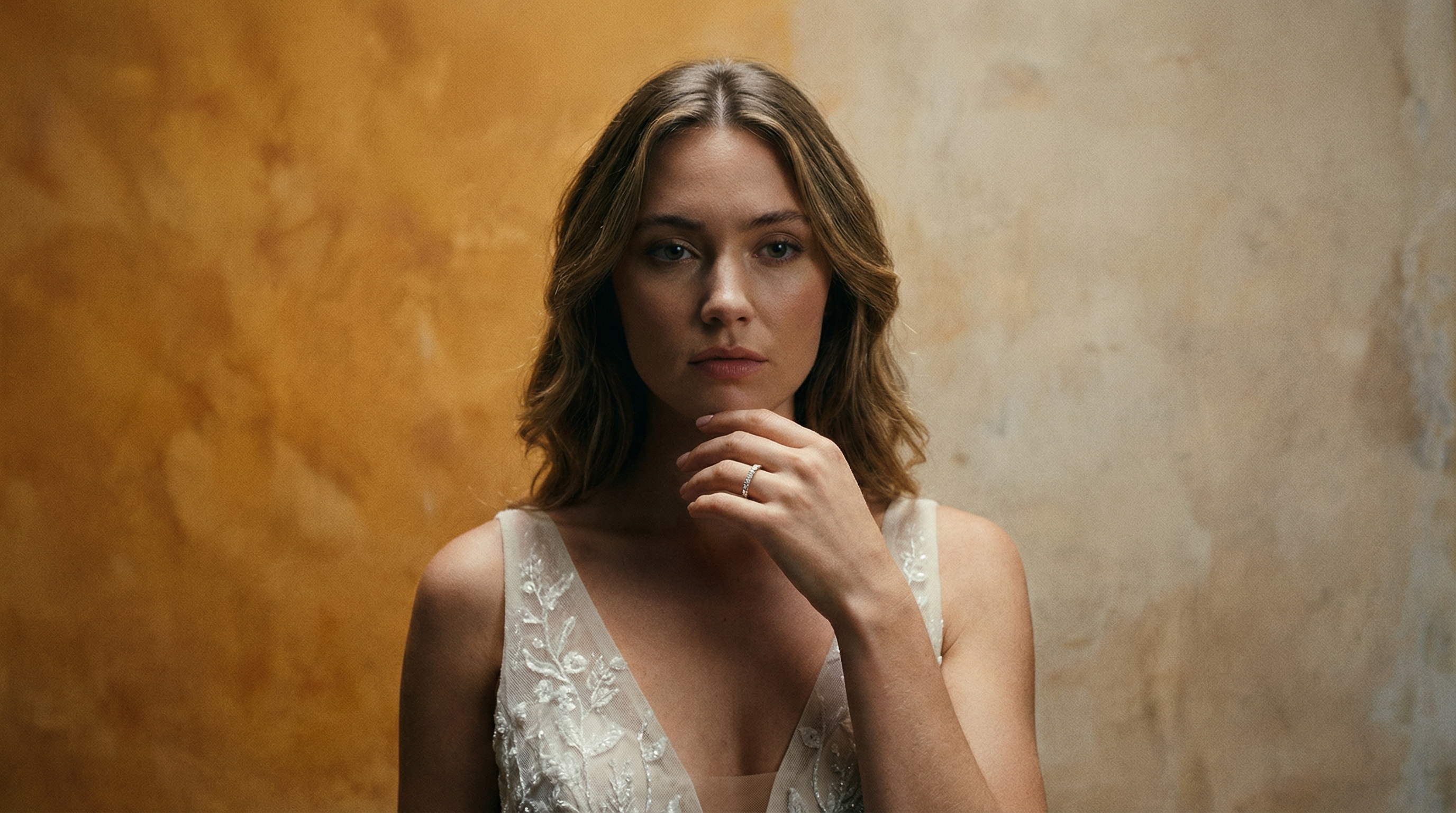 woman in a wedding dress wearing a diamond set wedding band in platinum