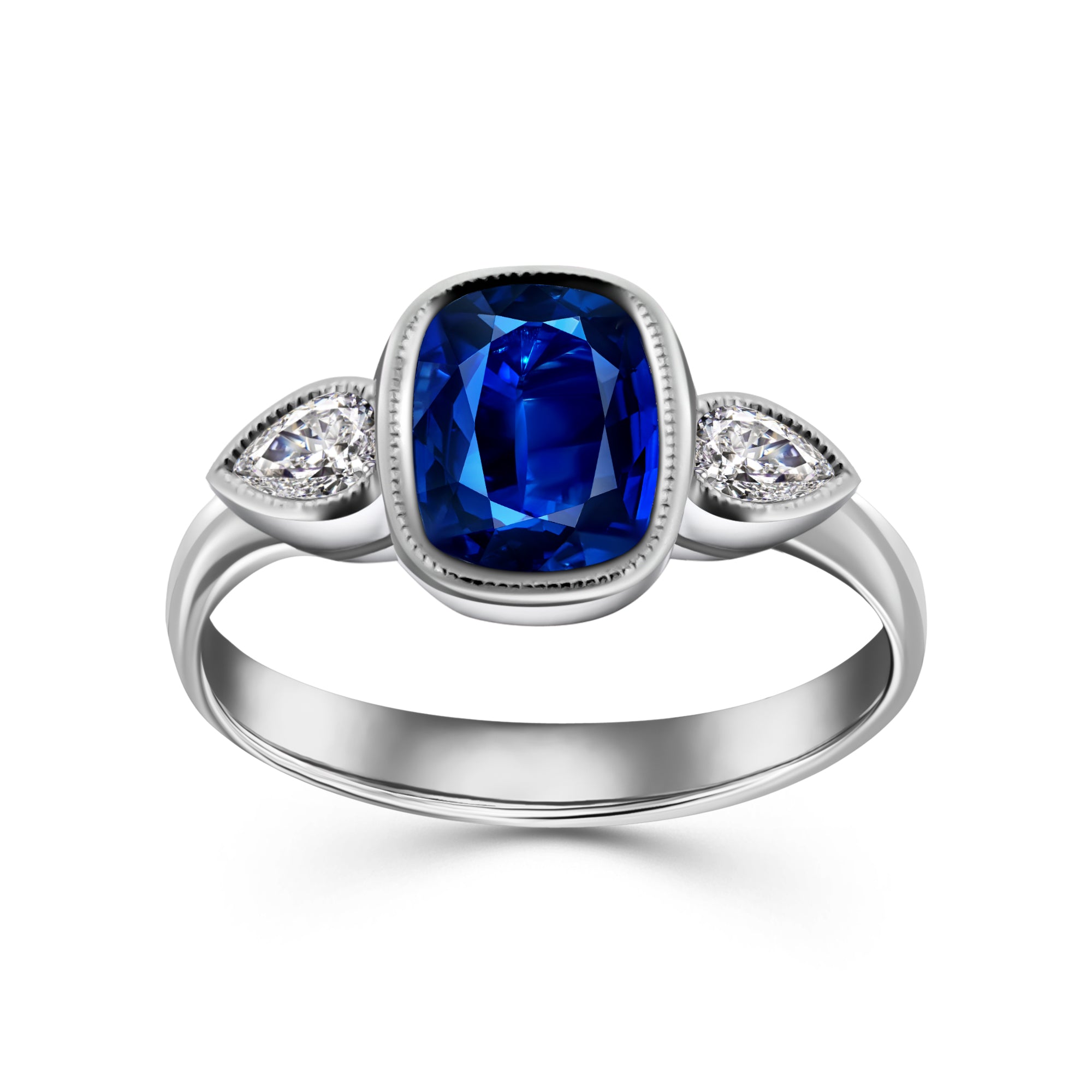 White gold ring with a cushion-cut blue sapphire center stone in a bezel setting, flanked by two pear-shaped diamond side stones.